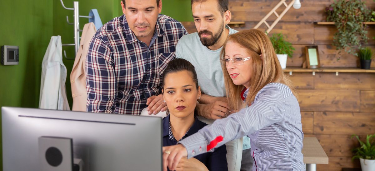 middle-age-female-manager-pointing-into-computer-m-2023-11-27-04-58-57-utc